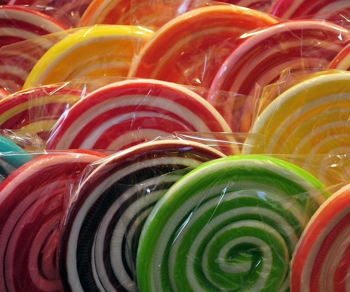 Shelves lined with colorful wrapped sweets and chocolates